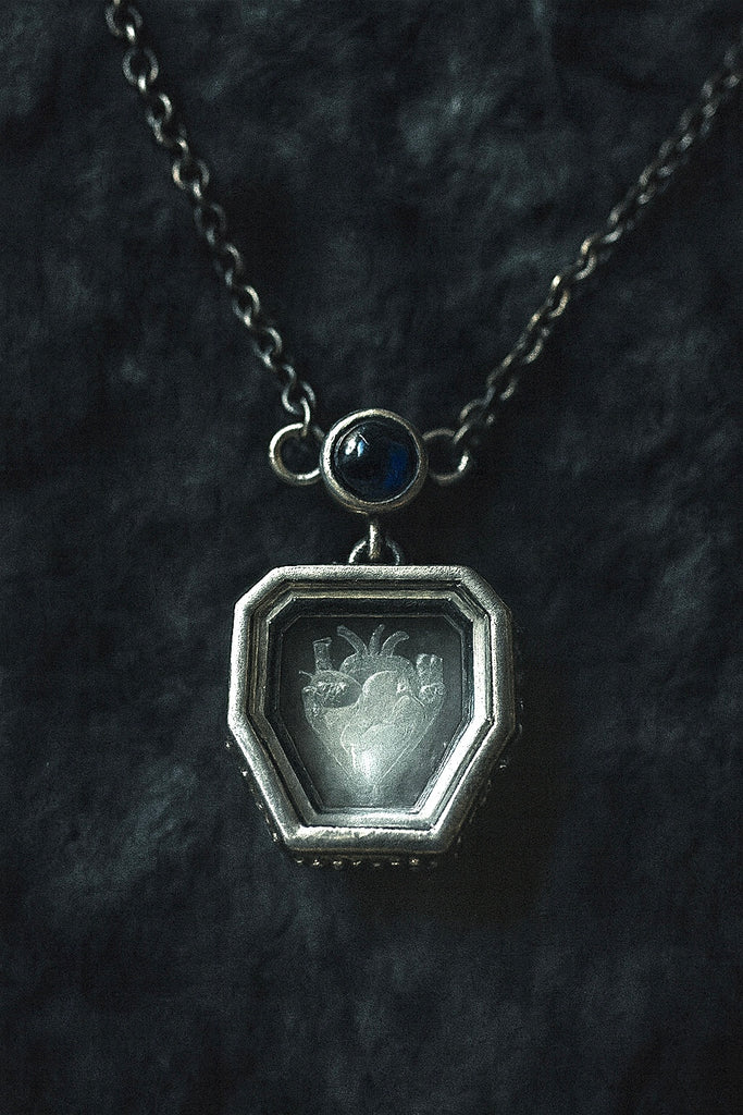 Heart engraved Crystal with blue sapphire necklace
