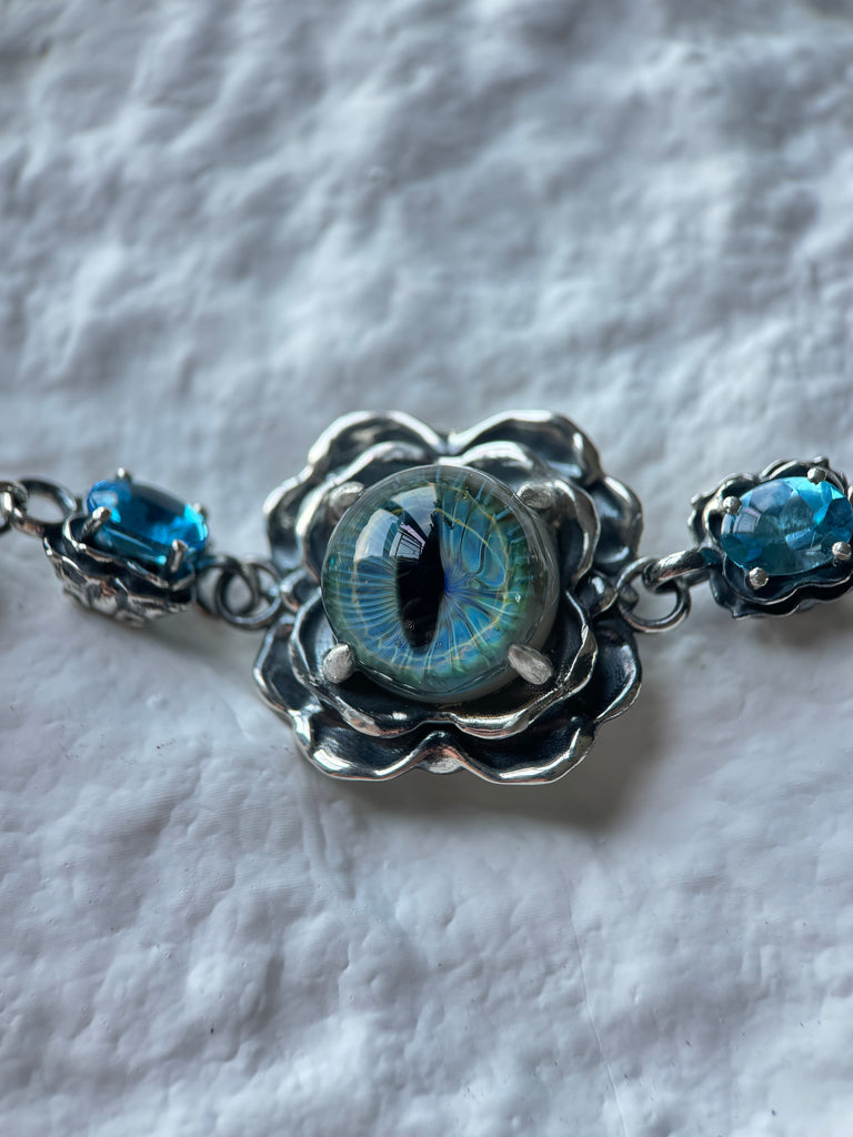 Glass eye blue topaz bracelet