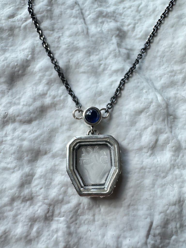 Heart engraved Crystal with blue sapphire necklace
