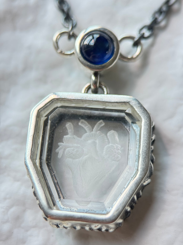 Heart engraved Crystal with blue sapphire necklace